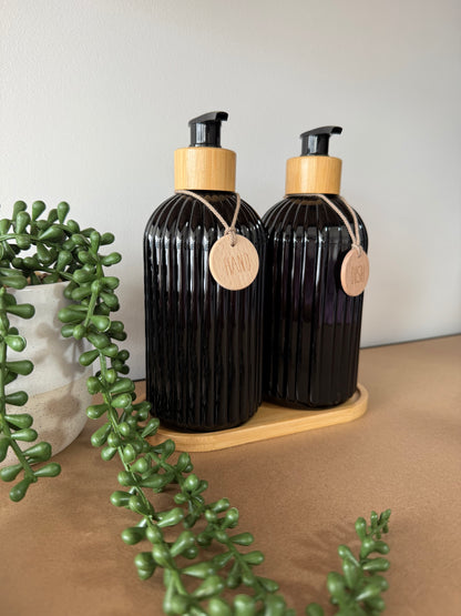 Dispenser bottles with wooden tray